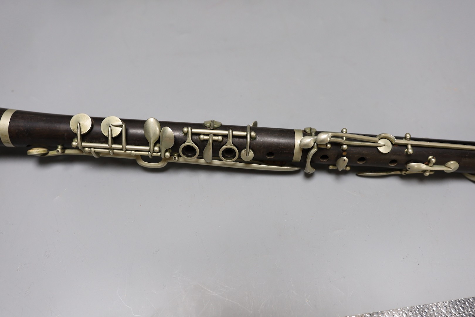 A ‘Superior Class’ Hawkes & Son clarinet and a cased Rampone and Cazzani ‘Judson’ ’ clarinet, 67 cm long.